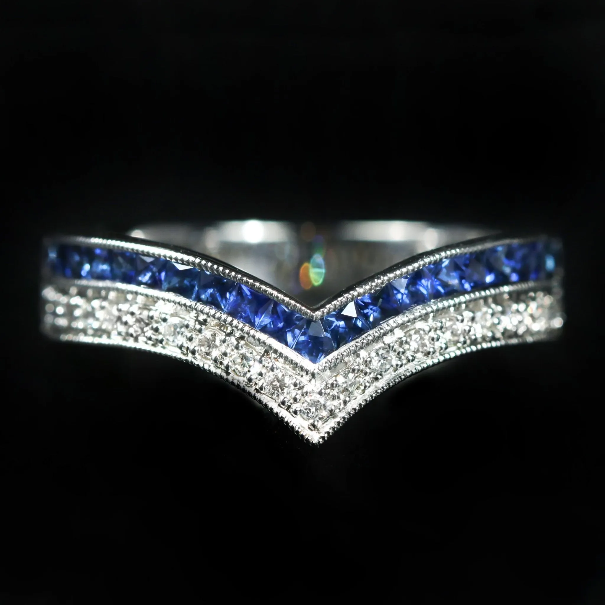 Platinum 0.16 Carat Diamond and French Cut Blue Sapphire Curve Band