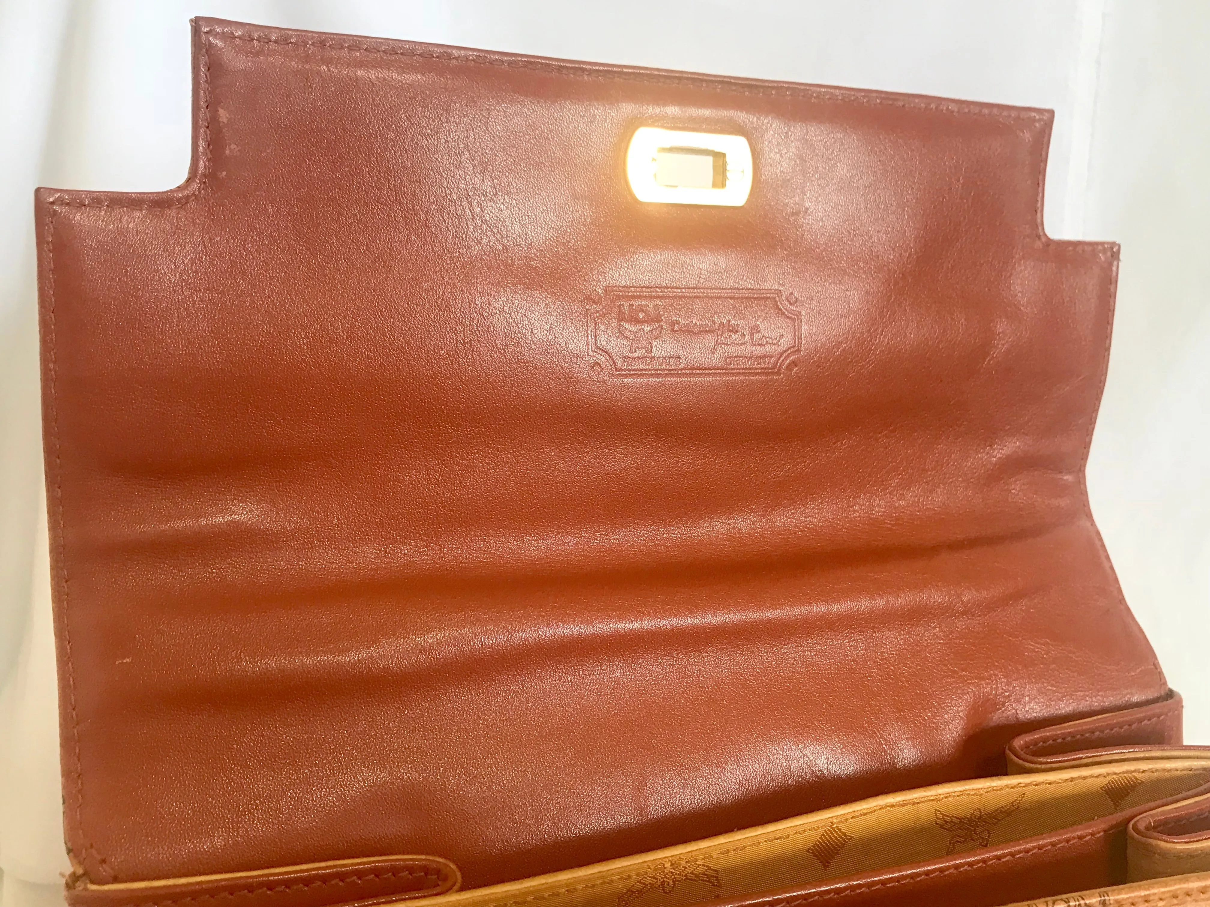 Vintage MCM classic brown monogram Kelly bag with golden logo plate. Perfect daily use bag.  By Michael Cromber, Germany