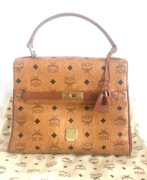 Vintage MCM classic brown monogram Kelly bag with golden logo plate. Perfect daily use bag.  By Michael Cromber, Germany