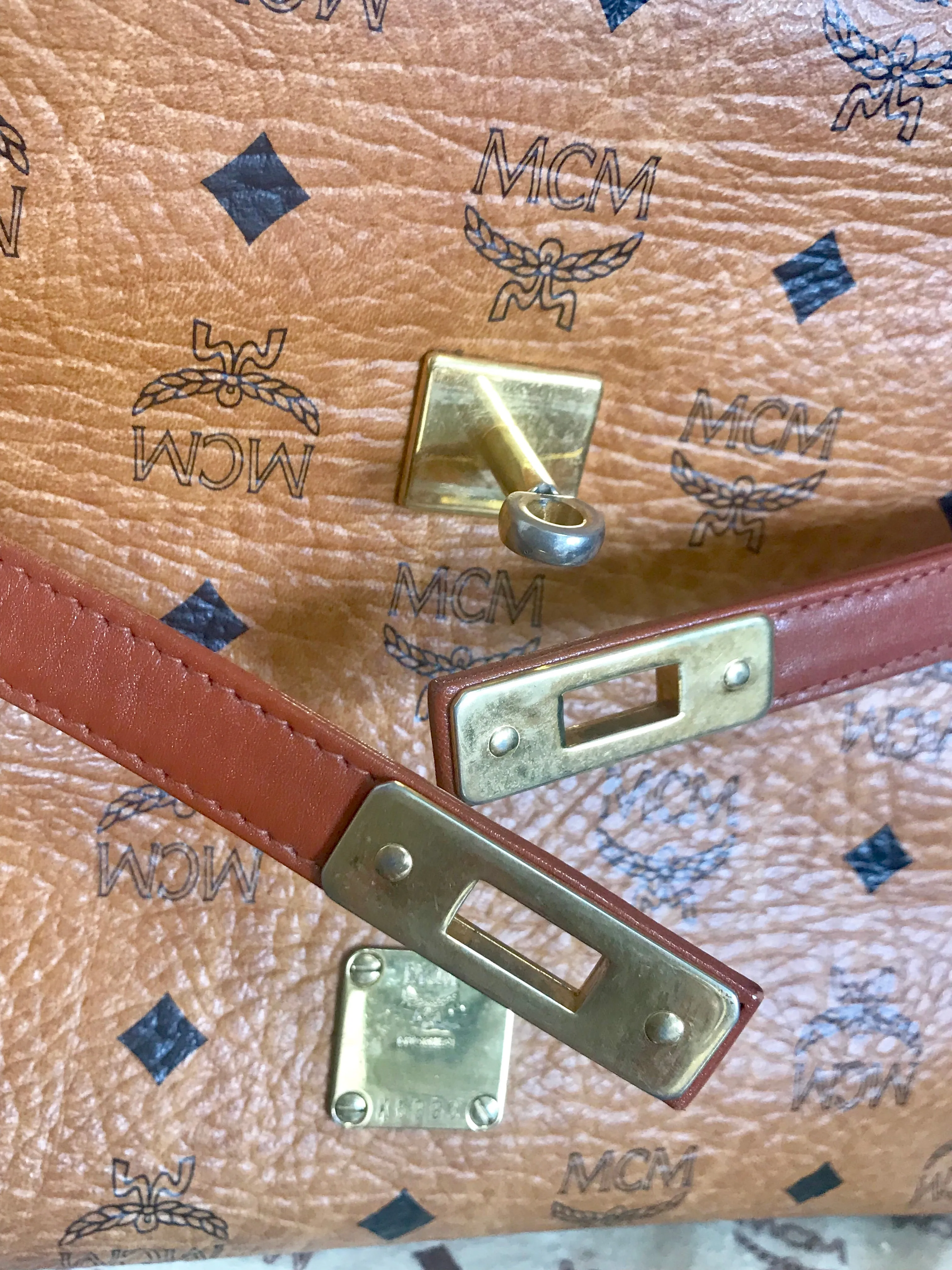 Vintage MCM classic brown monogram Kelly bag with golden logo plate. Perfect daily use bag.  By Michael Cromber, Germany