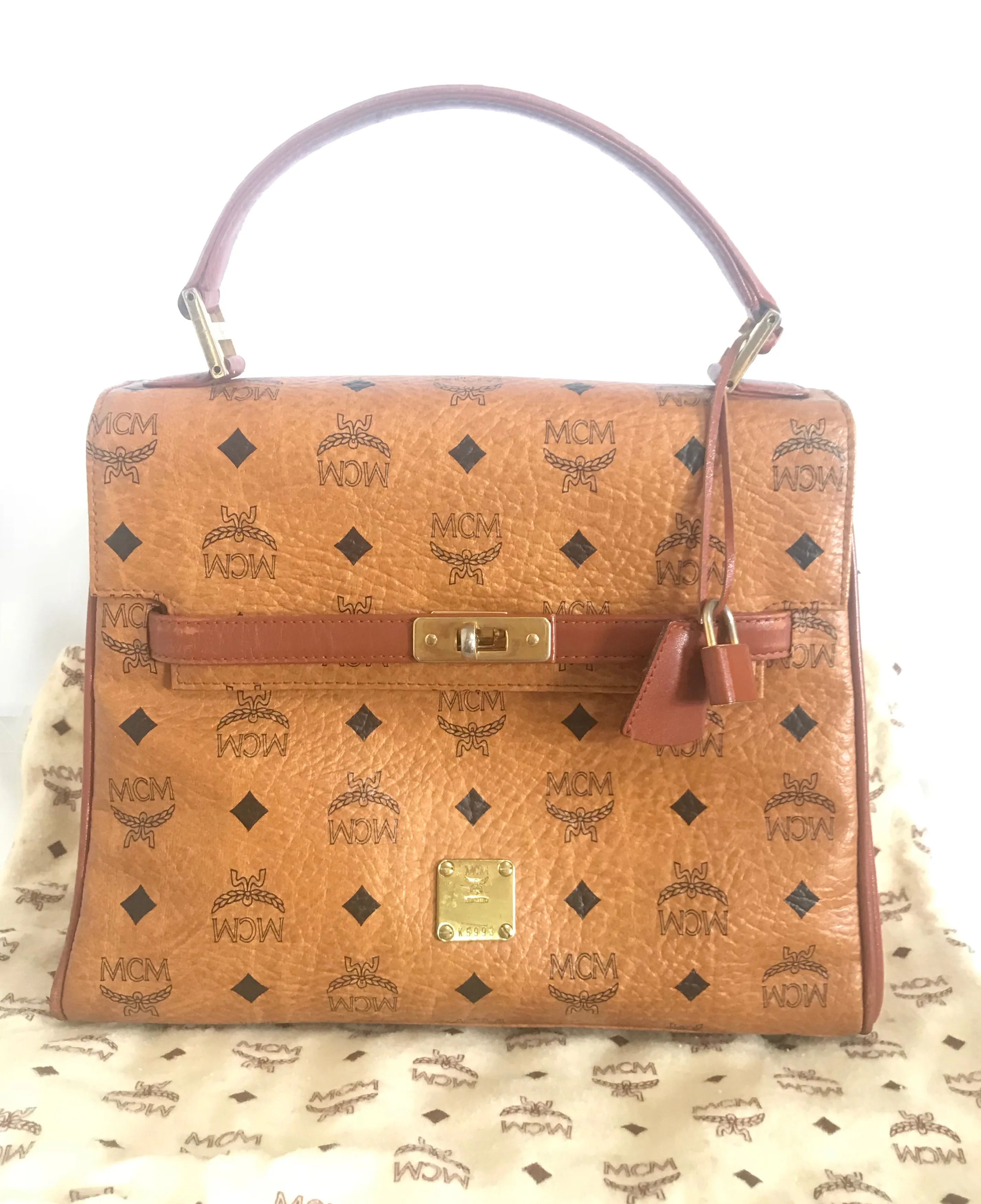 Vintage MCM classic brown monogram Kelly bag with golden logo plate. Perfect daily use bag.  By Michael Cromber, Germany