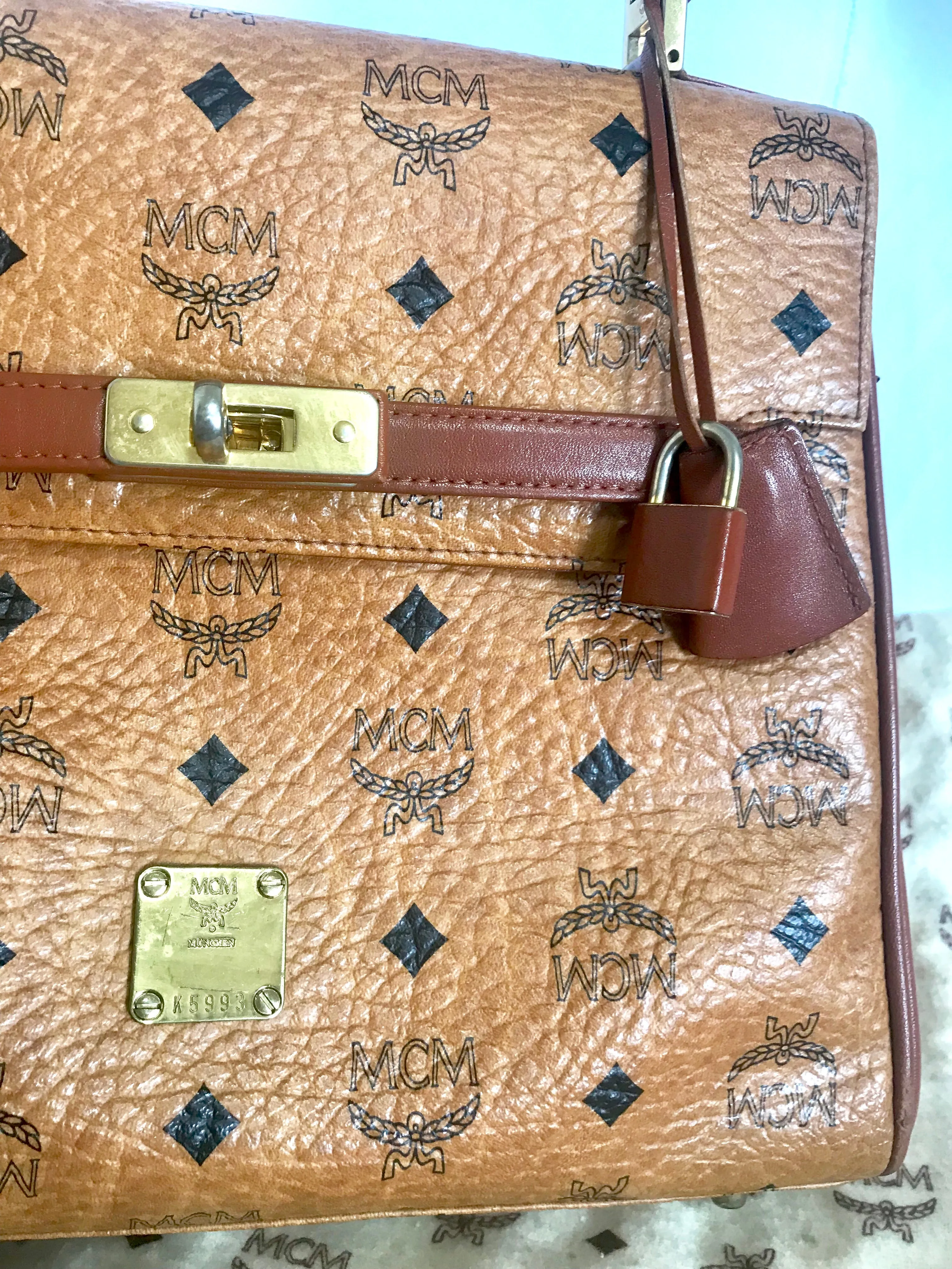 Vintage MCM classic brown monogram Kelly bag with golden logo plate. Perfect daily use bag.  By Michael Cromber, Germany