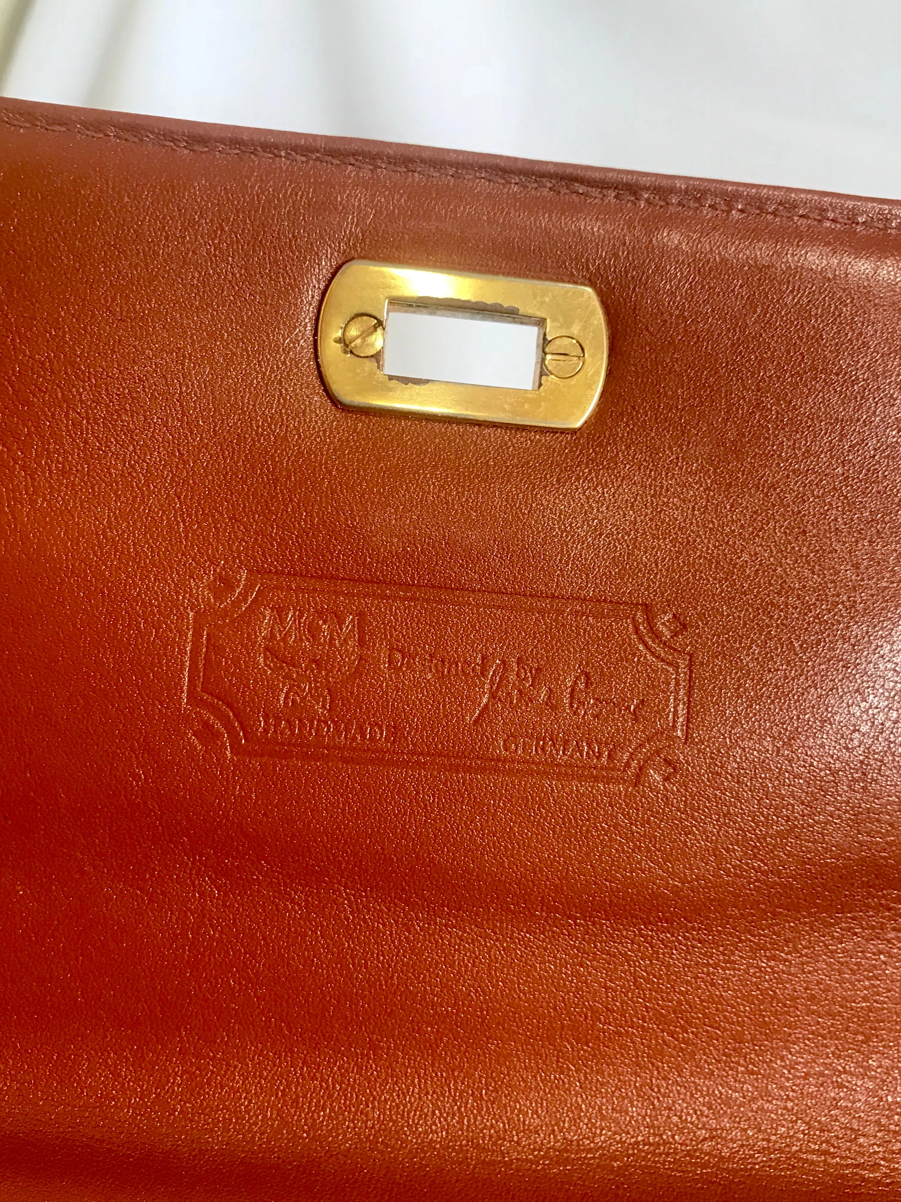 Vintage MCM classic brown monogram Kelly bag with golden logo plate. Perfect daily use bag.  By Michael Cromber, Germany