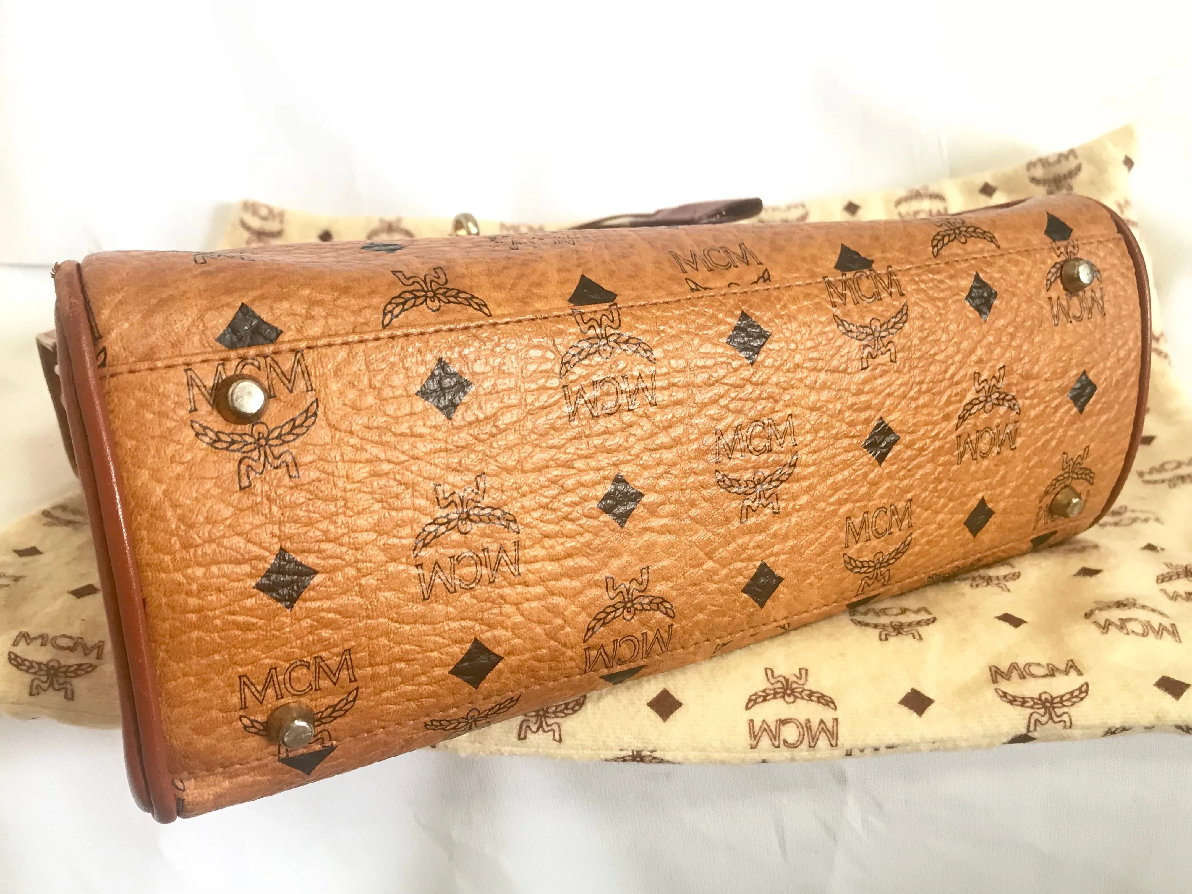 Vintage MCM classic brown monogram Kelly bag with golden logo plate. Perfect daily use bag.  By Michael Cromber, Germany